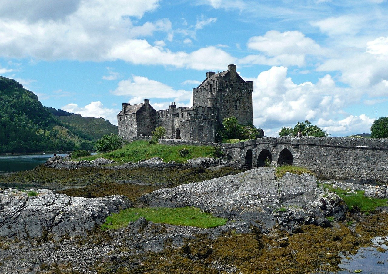 Historic Scottish castle on a rocky coast, part of the Heritage Trails for personalized ancestral tours in Scotland