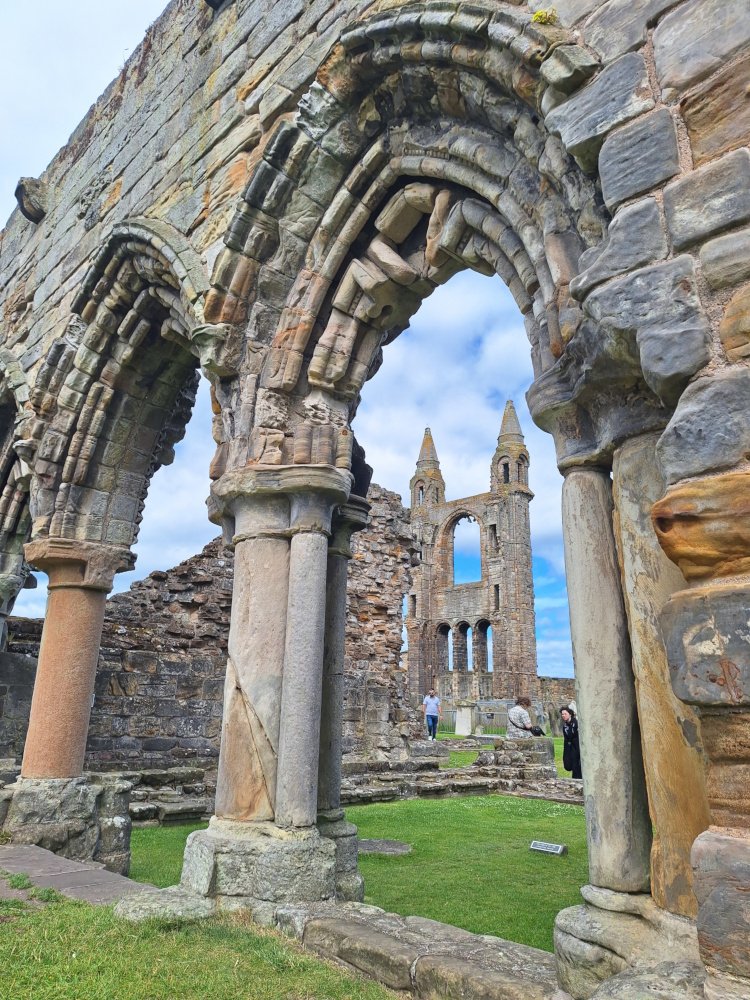 Ruins of St Andrews Cathedral seen through ancient arches, a highlight of the St Andrews by the Coast - The Kingdom of Fife tour
