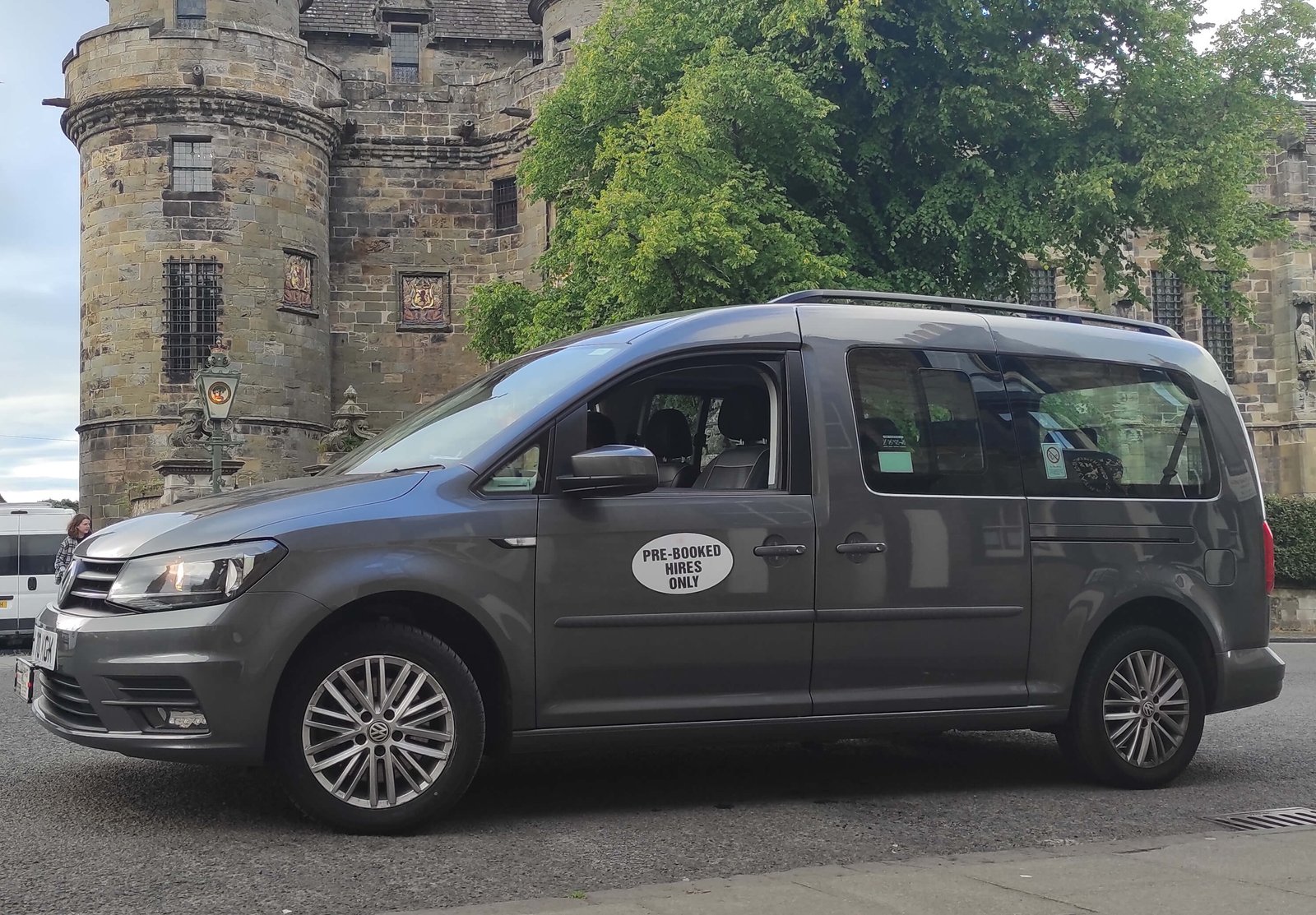 Luxury car of EdiVentures for St Andrews Tour on the background of Falkland Palace